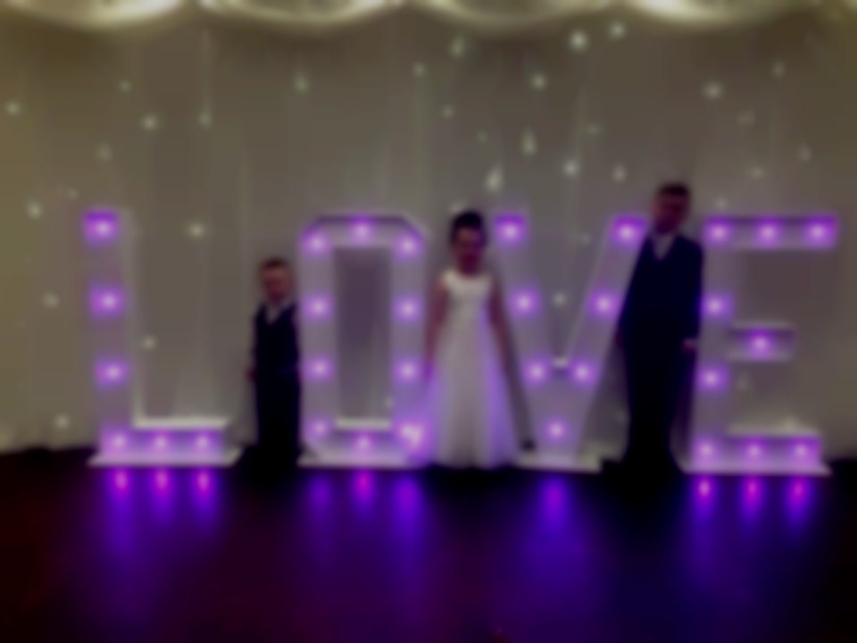 Large illuminated love letters in a choice of colours Giant light up love letter hire South Wales