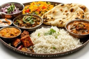 delicious-indian-thali-featuring-diverse-dishes-served-on-a-traditional-metal-platter-free-phot.jpeg