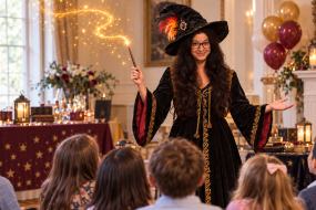 magician-performs-golden-wand-magic.png