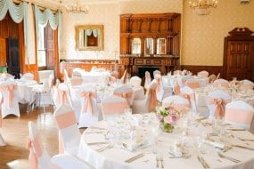 Alfreton Hall, chair covers, blush linen sashes and floral centerpieces