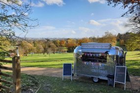 The Tin Canteen chrome ice cream van in a London park