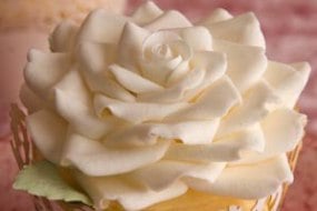 Wedding cupcakes with intricate sugar rose toppers