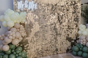 Sequin wall, meon sign and balloon garland