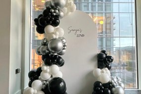 Balloon garland with a personalised backdrop