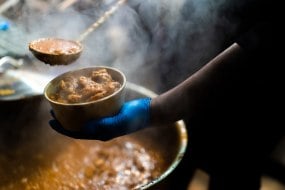 Our best selling dish, Chicken Curry, cooked on site & served piping hot from the pan!