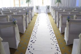 Bowood Hotel with white chair covers, sashes and the aisle runner Bowood Hotel with white chair covers, sashes and the aisle runner