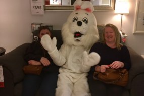 easter bunny mascot with happy guests