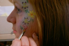 Janet Allen Face Painting her face
