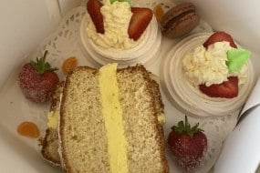Strawberry meringues with fresh cream, lemon drizzle loaf cake filled with lemon butter cream, macaroons
