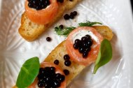 Smoked salmon roll and créme fraiche on focaccia crostino and soy caviar