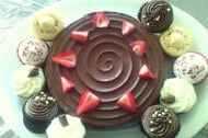 chocolate fudge cake topped with strawberries