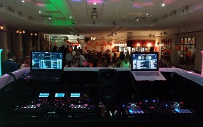 behind booth 2 dj set up