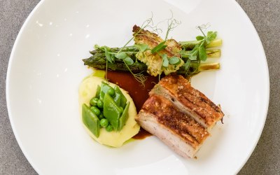 Slow roast pork belly, romanesco, asparagus, peas