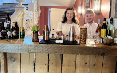 Indoor wooden bar - with the happy team.