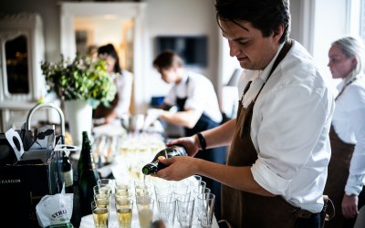 Chris pouring prosecco for wedding