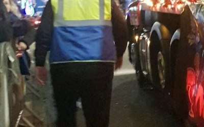 team 5 walking alongside the floats.
