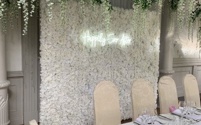 Flower wall with neon sign