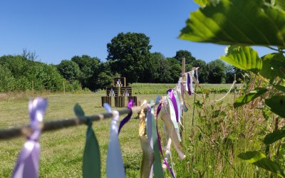 Custom ribbon bunting and our Tin Can Alley game behind, also in custom corporate colours