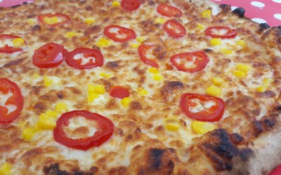 a chilli pepper and sweetcorn pizza