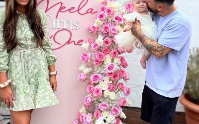 One meter wide back drop hire with floral design and personalised message 