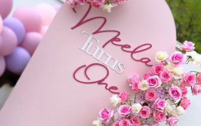 One meter wide back drop with floral designs and personalised message 