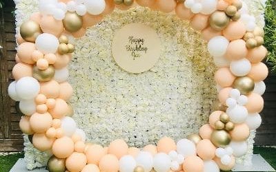 Birthday Party with Rose wall and circle balloon stand 