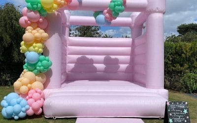 Pastel pink bouncy castle