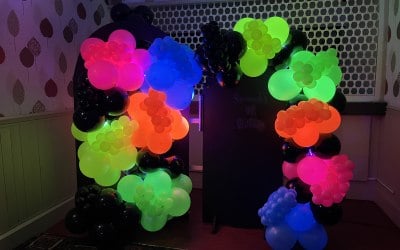 Sail boards and neon balloon display 