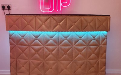 our gold bar with one of our signs