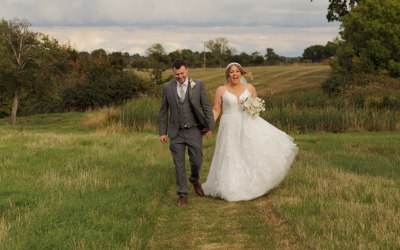 Bride and Groom Walking Hand in Hand
