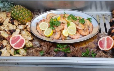 BBQ with a selection of meats and king prawns