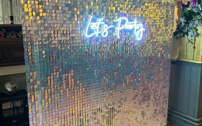 Sequin wall and neon sign