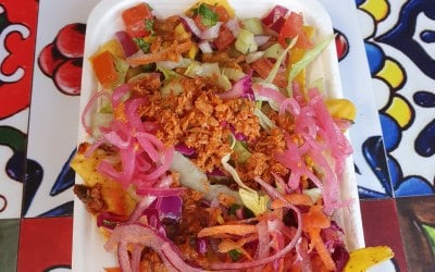 Chilli on tortillas with 'slaw, salsa, vegan Mexican chorizo and Mexican pink onions.