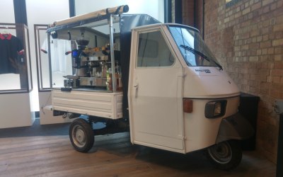 White Piaggio Ape coffee van
