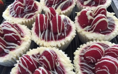 Mini white chocolate and raspberry cheesecakes