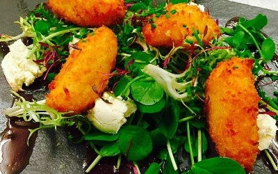 Crispy marinaded tomatoes with goates cured and pomegranate molasses