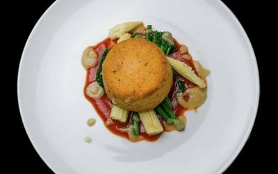 Sun dried tomato polenta, baby veg and spiced tomato sauce