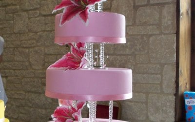 Four-tier pink cake with Stargazer lilies