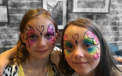 two beautiful face painted butterflies