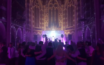 Premium Show in white with mirror ball, starlit backdrop and uplighting add-on