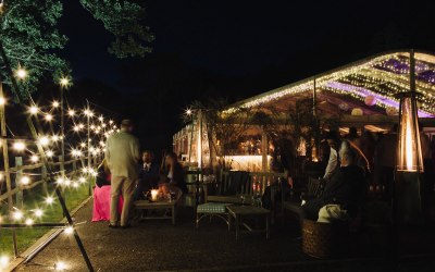 A clearspan marquee lit with fairy lights 