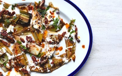 Roast leeks with yogurt, caramelised chilli butter & pecans 