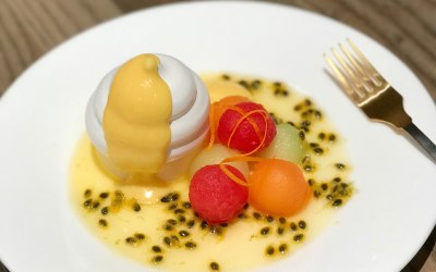 Passionfruit mousse and curd with meringue and a melon salad, 