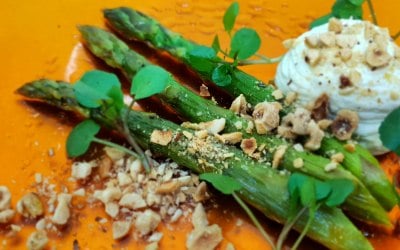 English Asparagus with truffle emulsion and roasted hazelnuts