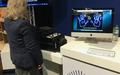 Delegate having Kirlian aura photographed on the stand