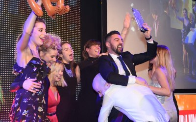 Award winners celebrate on stage