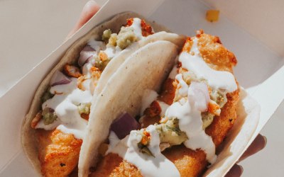 Fish Tacos with mango and mint salsa, guacamole and lime crema