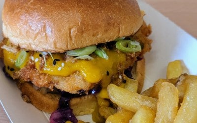 Prawn Katsu burger with crispy onions, spring onions, black sesame and fries