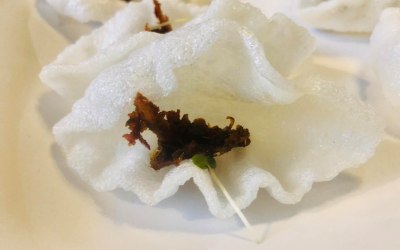 Prawn cracker topped with chili paste