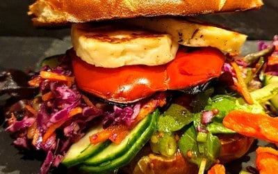 Halloumi and Roasted red pepper burger in a pretzel bun